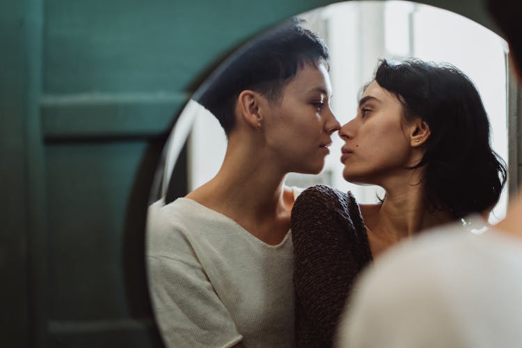 Couple Reflection In Mirror