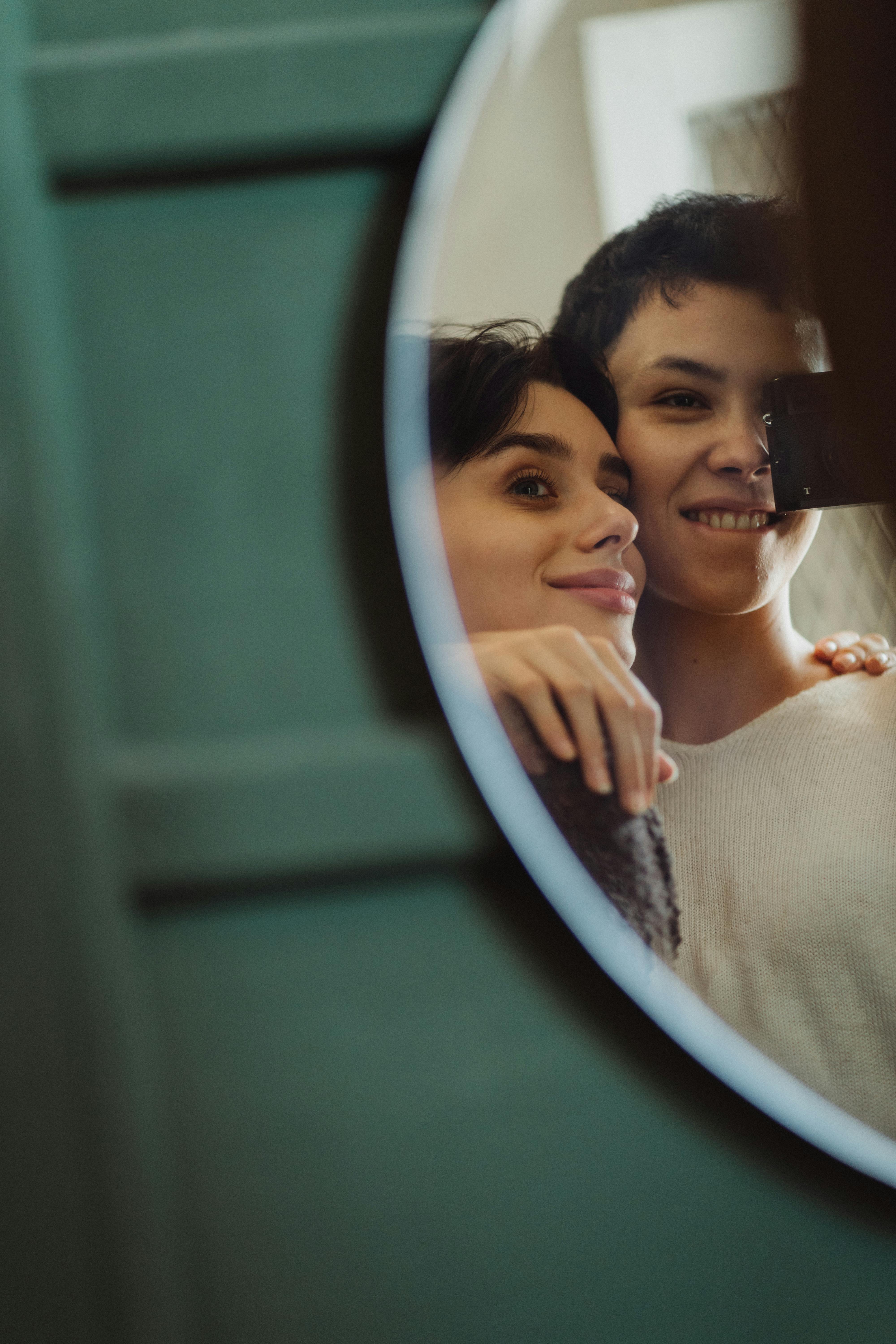 reflection of two women in a mirror