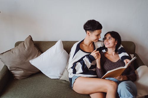 Free Smiling Couple with Book Stock Photo
