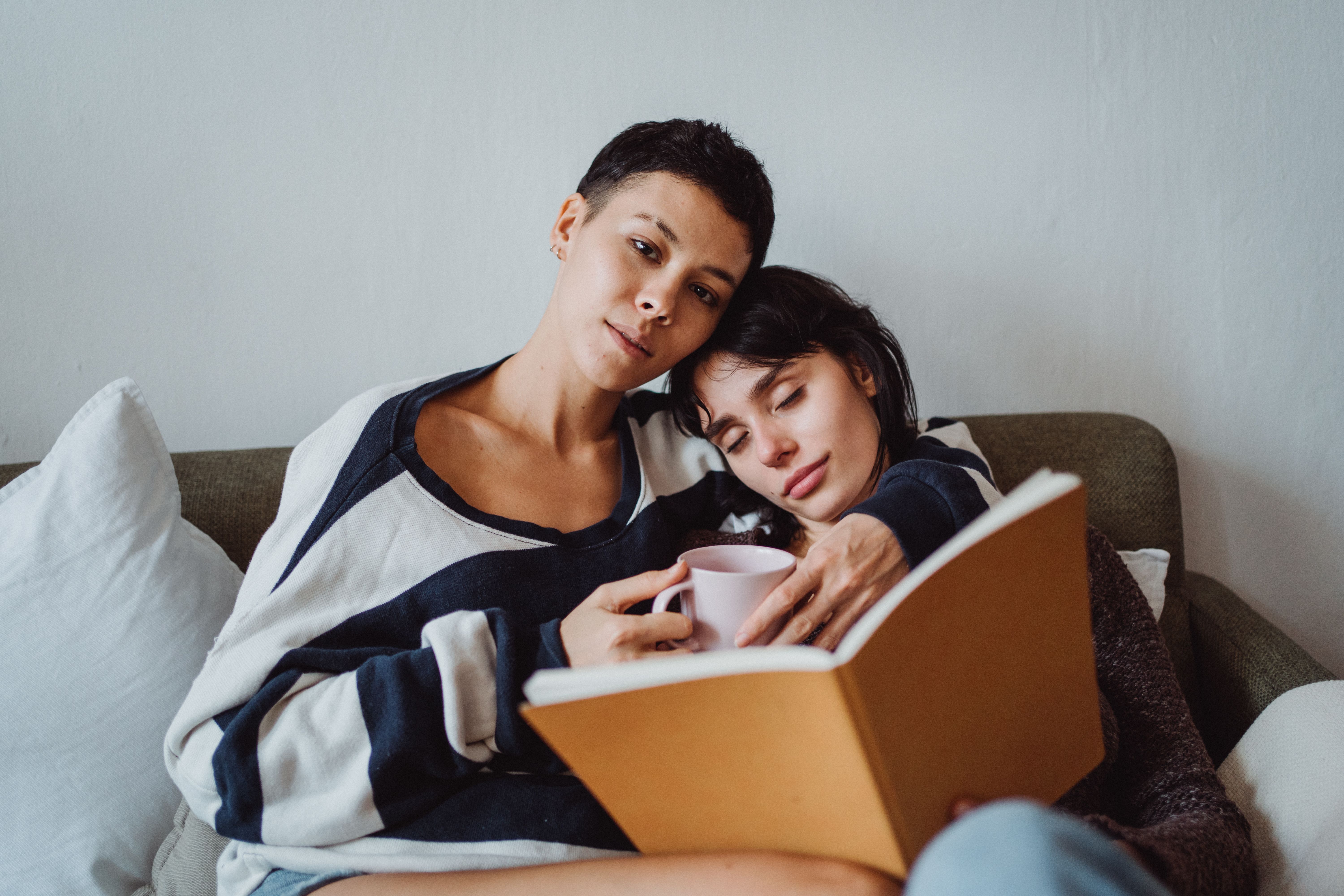 Two Women Sitting with a Book · Free Stock Photo