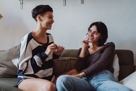 Women Sitting on Couch Talking