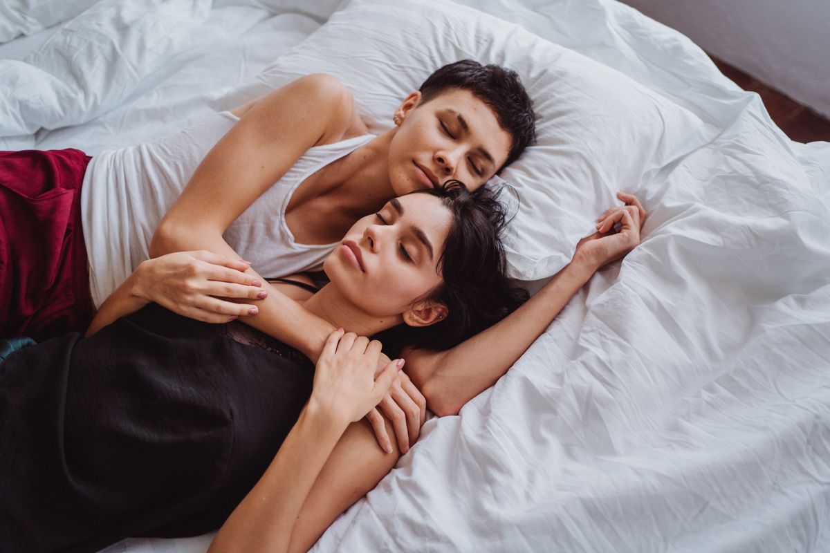 Couple sleeping peacefully in bed after starting oral appliance therapy