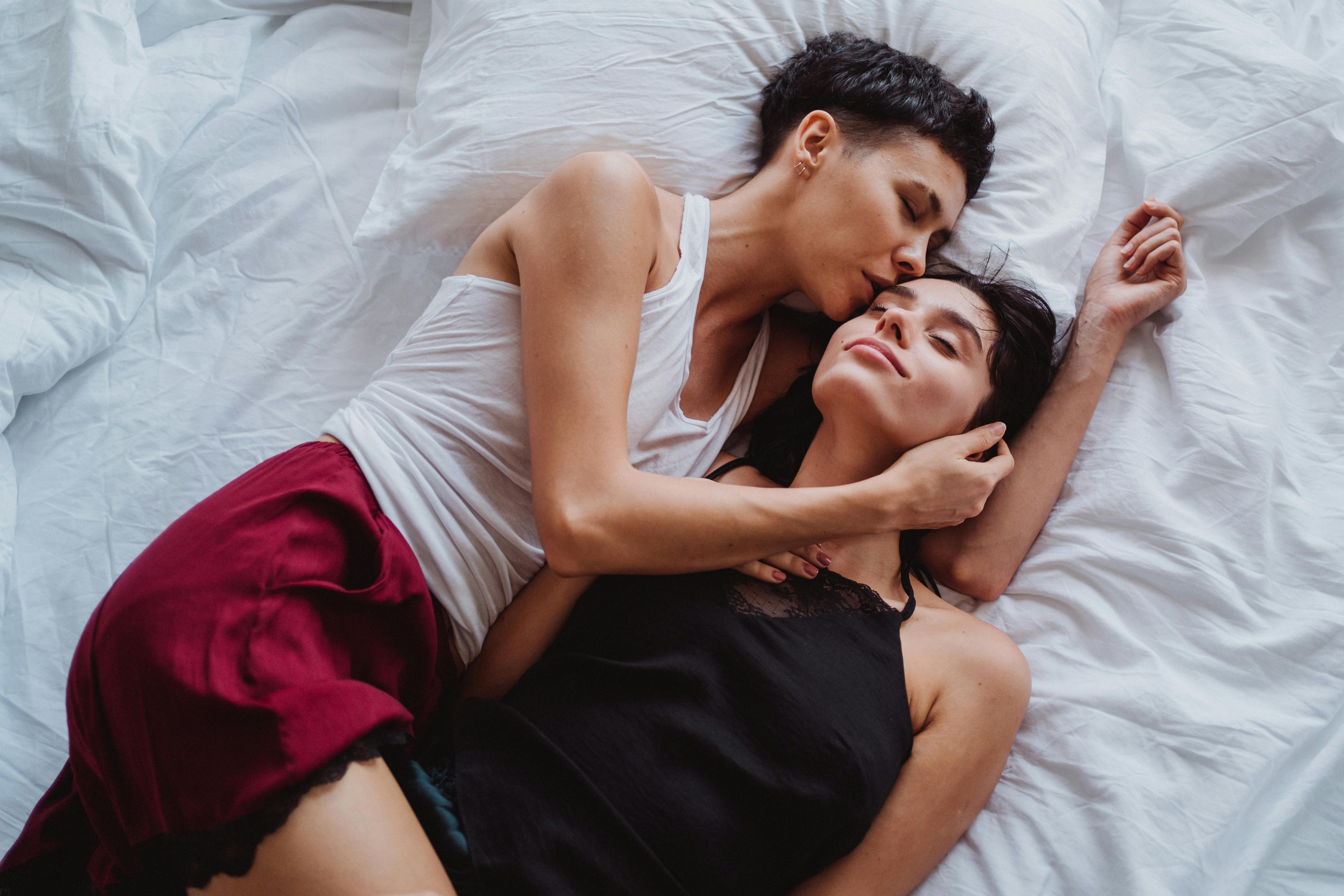 Two Women Lying in Bed · Free Stock Photo photo