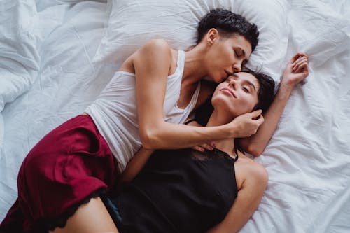 Free Two Women Lying in Bed Stock Photo
