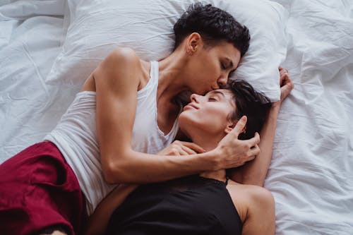 Free Two Women Lying in Bed Stock Photo