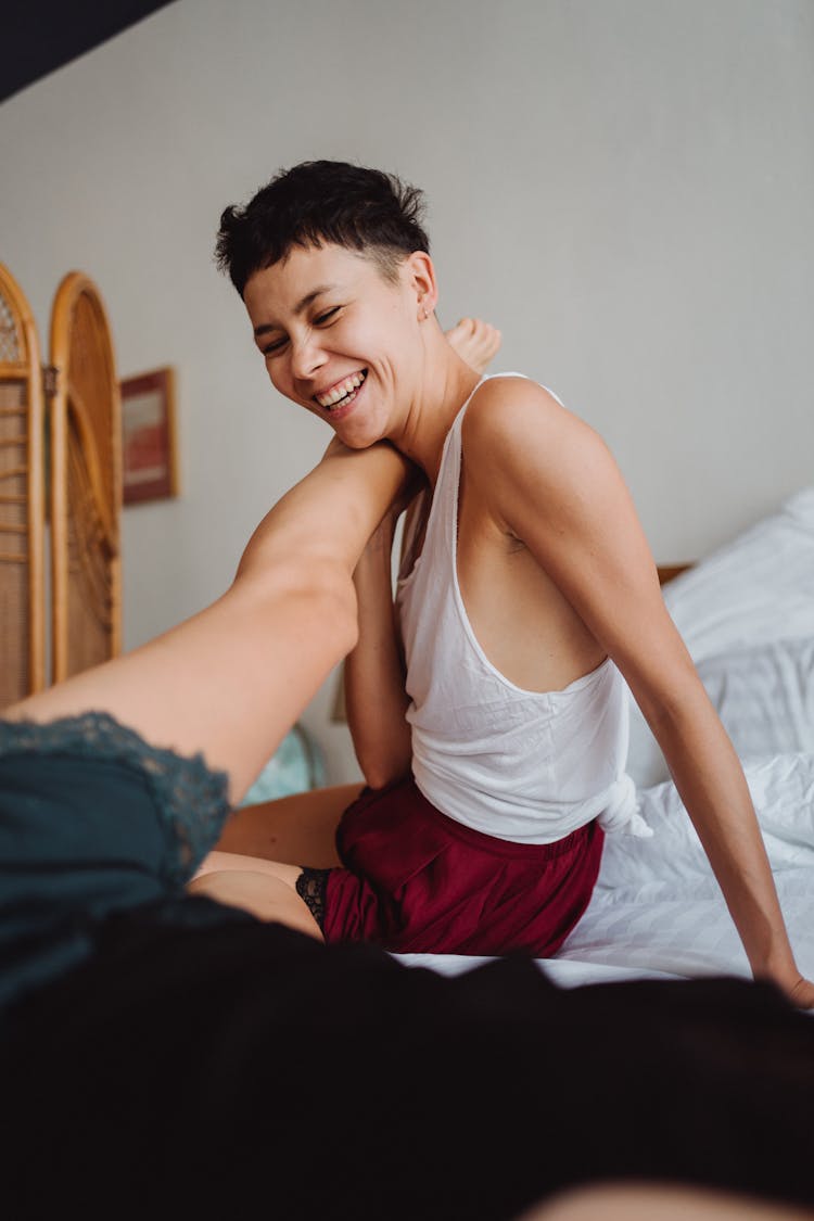 Couple Playing In Bed