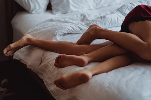 Free People Lying in Bed Stock Photo