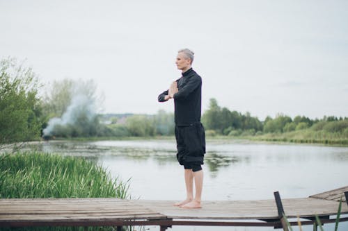 A Man Meditating by the Lake 