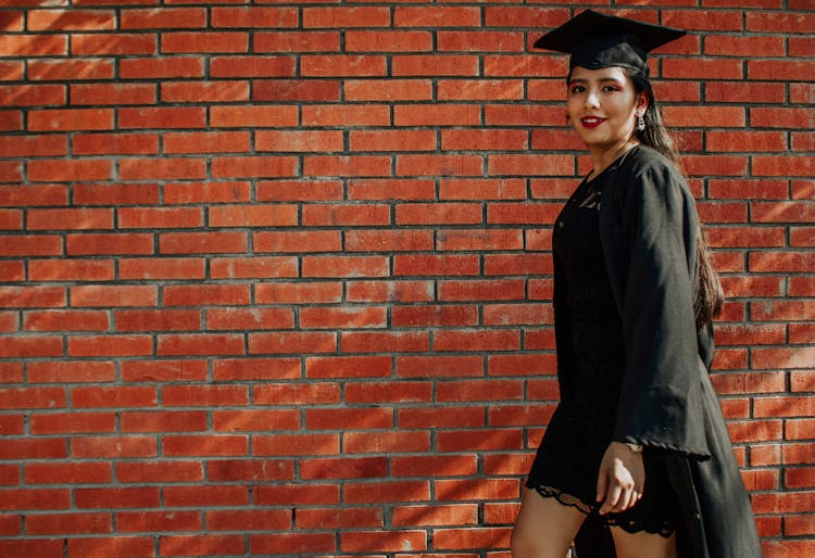 Positive Lady In Graduation Uniform