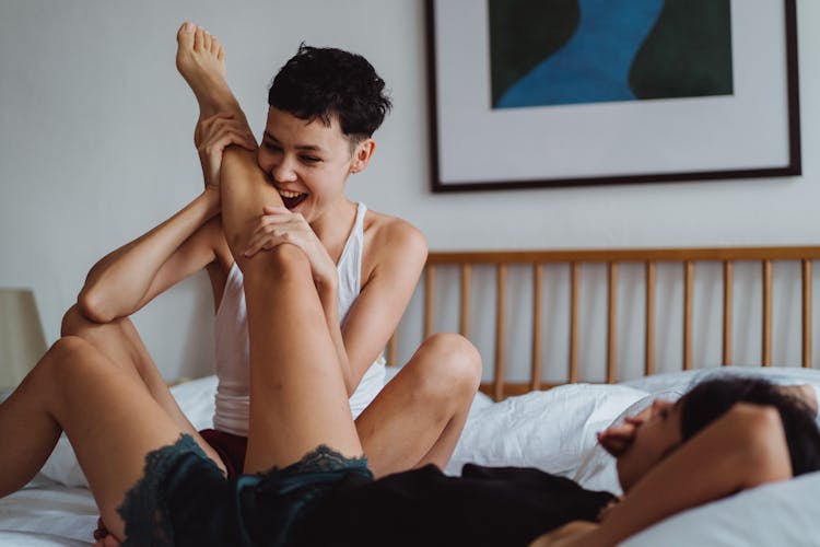 Couple Playing In Bed