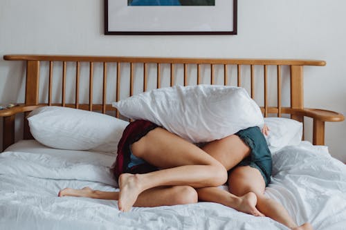 Free Two Women Lying in Bed Stock Photo