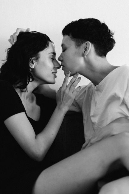 Black and white photo of a loving LGBT couple sharing an intimate moment.