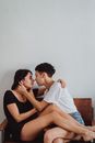 Couple Cuddling Looking in Eyes