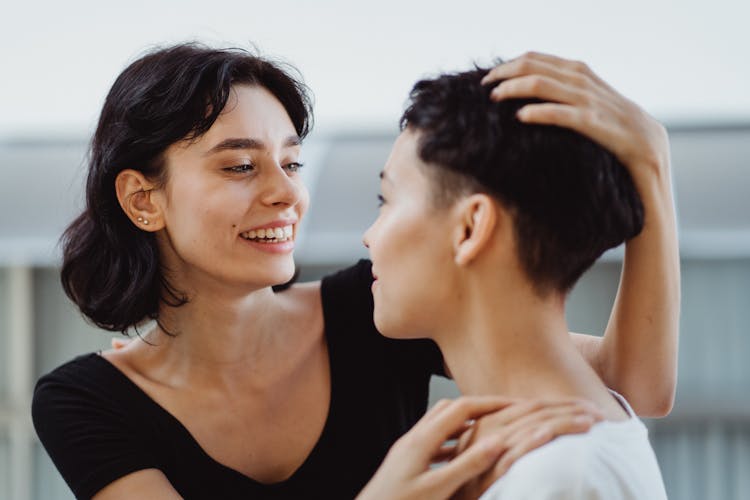 Woman Stroking Girlfriends Hair