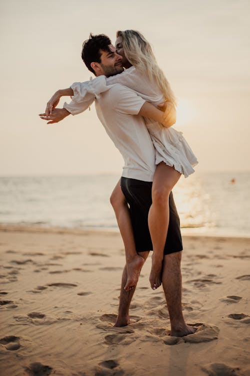 A Couple Embracing at the Beach