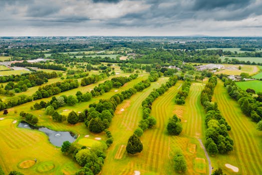 A picturesque aerial shot of Lucan's lush golf course in County Dublin, Ireland, showcasing the vibrant green landscape.