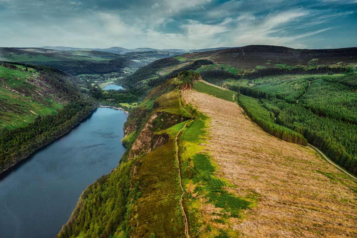 Aerial view of the lush green Wicklow Mountains with lakes nestled between valleys