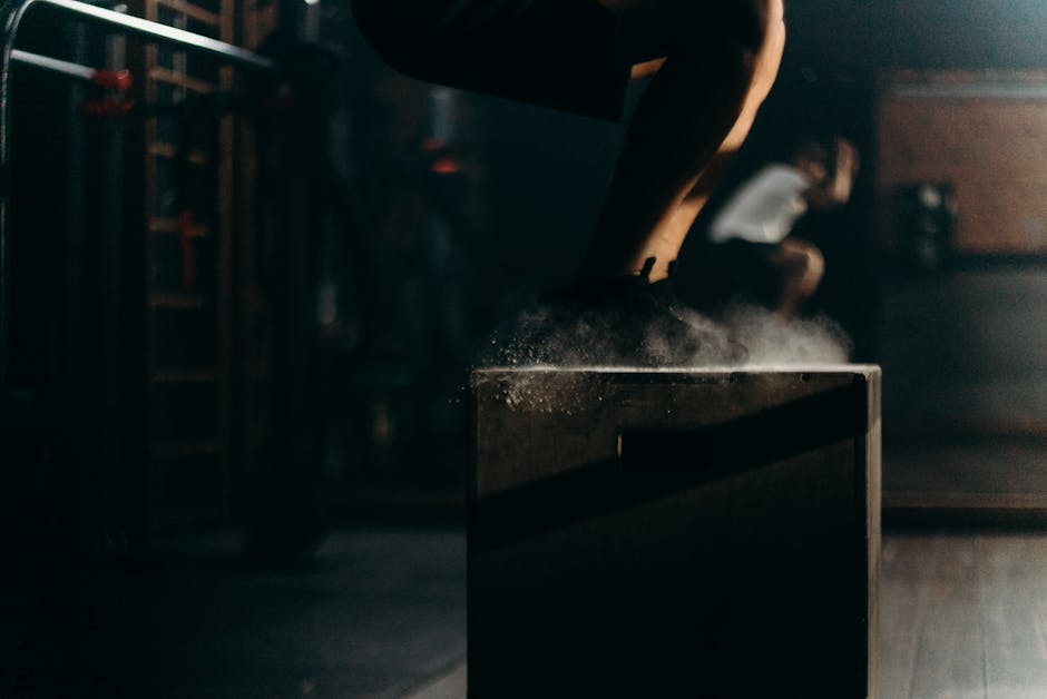 athlete performing box jump - athletic performance coach athlete performing box jump - athletic performance coach