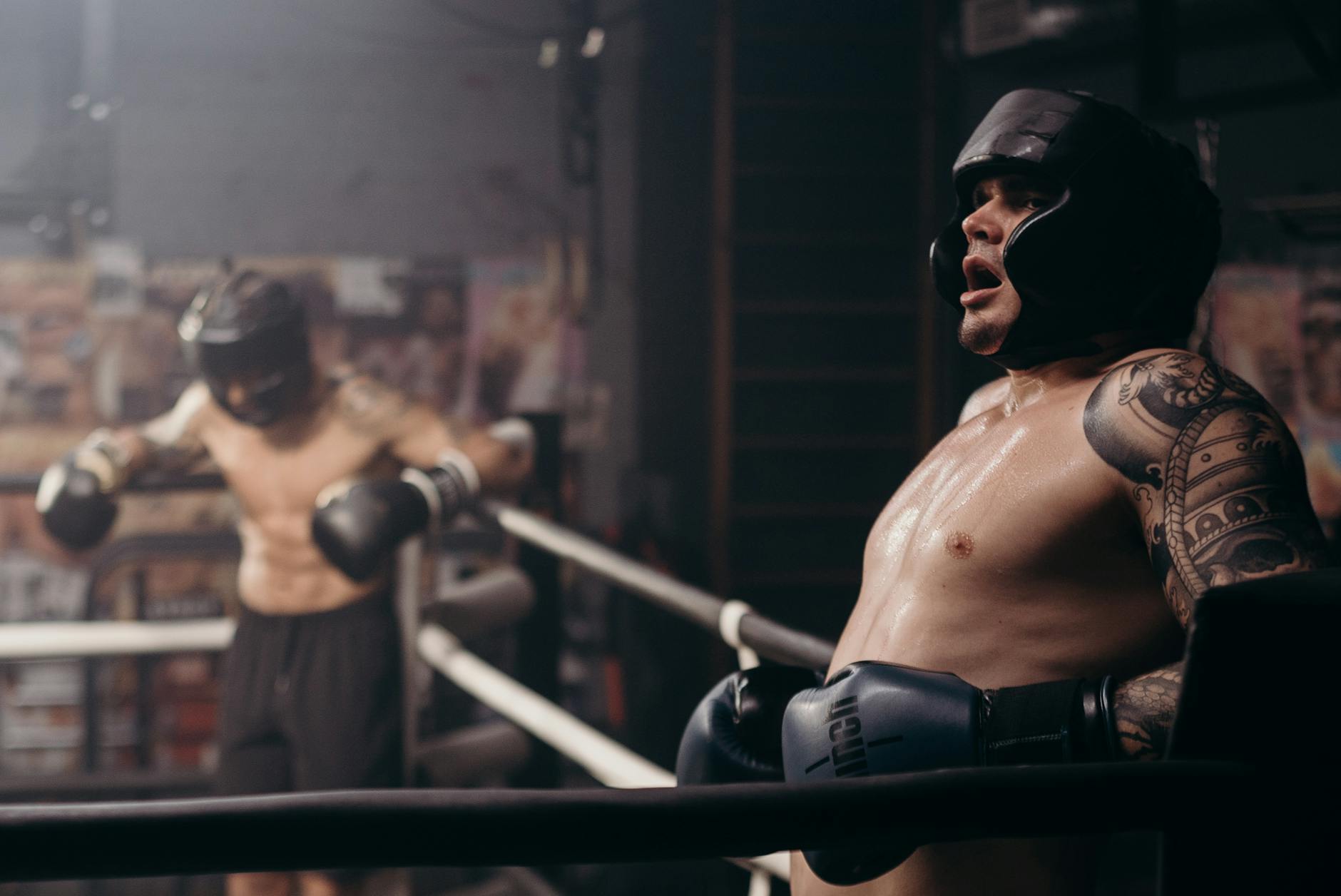 Topless Man Wearing Black Sunglasses and Black Boxing Gloves