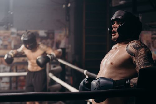 Free Two boxers engaged in a sparring session in a gym, showcasing strength and endurance. Stock Photo