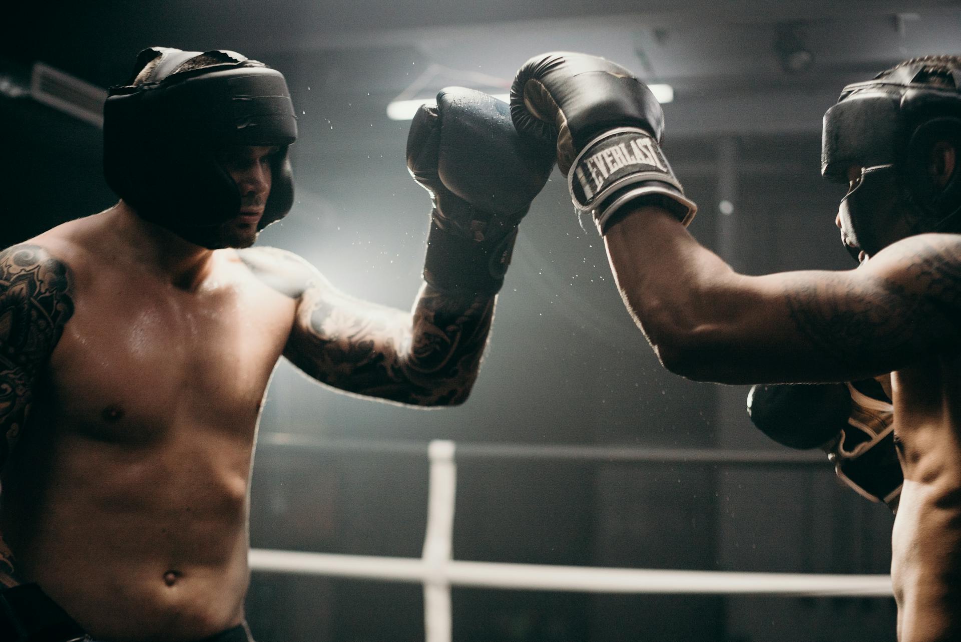 Man in Black Boxing Gloves