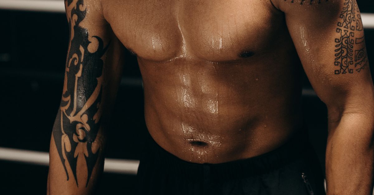 Topless Man With Black And White Face Tattoo Free Stock Photo topless-man-with-black-and-white-face-tattoo-free-stock-photo