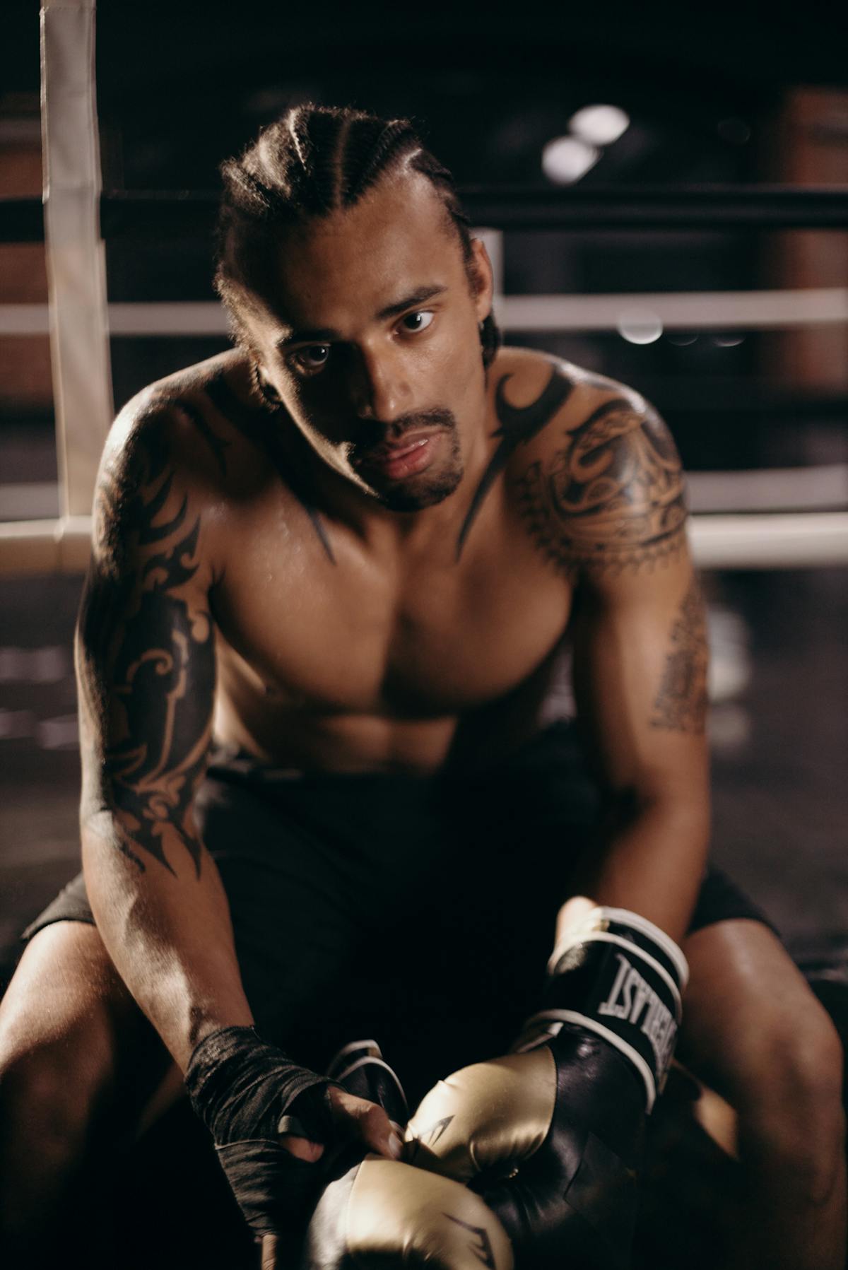 Wide view of a stadium show with fireworks and large crowd