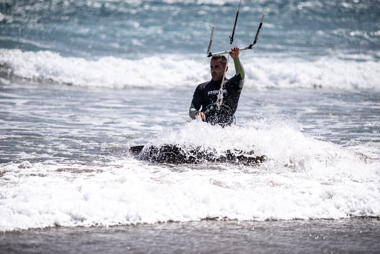 Man Wakeboarding On Sea