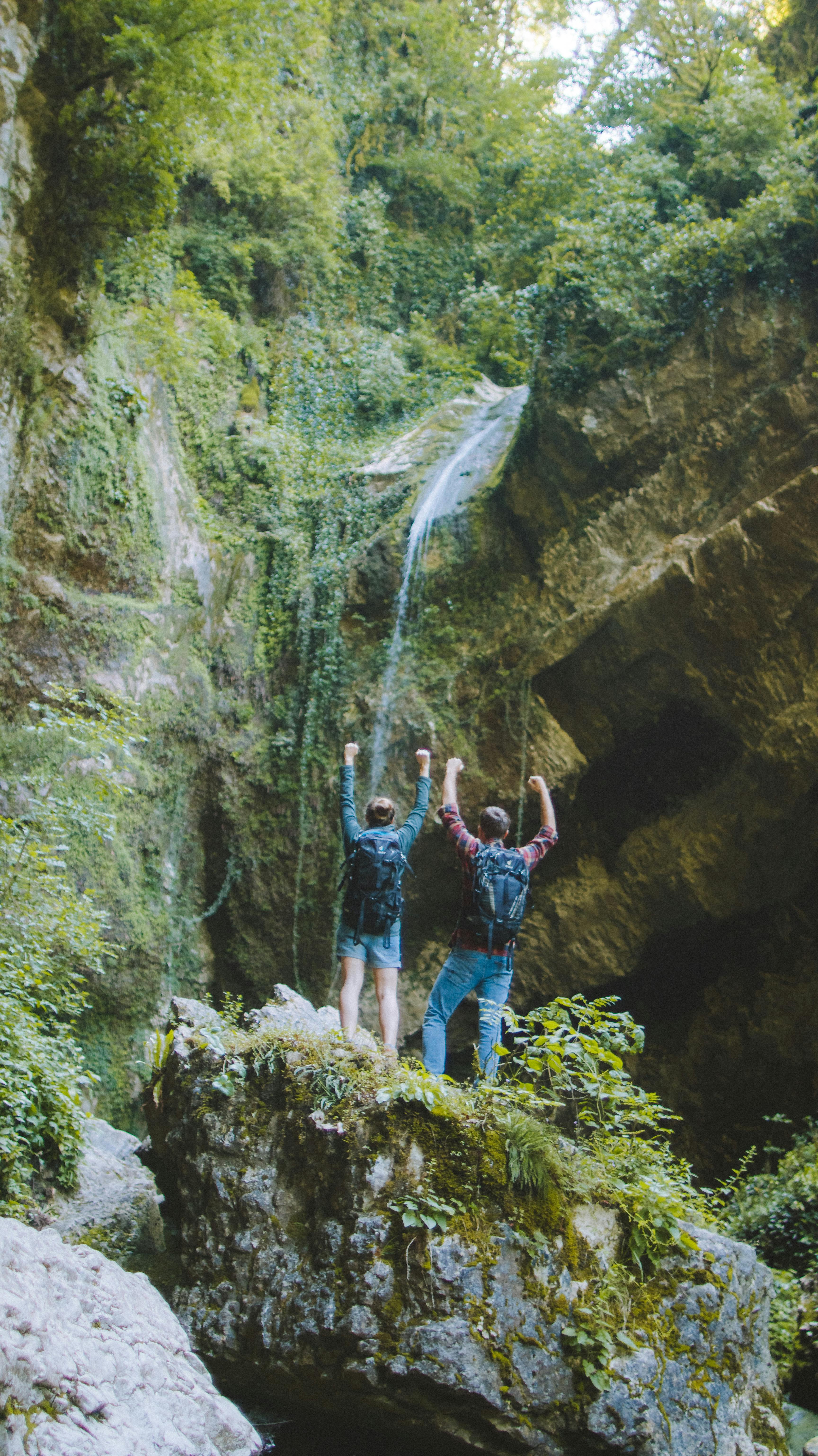 couple standing on rock