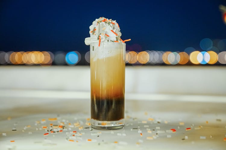 A Cocktail With Whipped Cream And Sprinkles