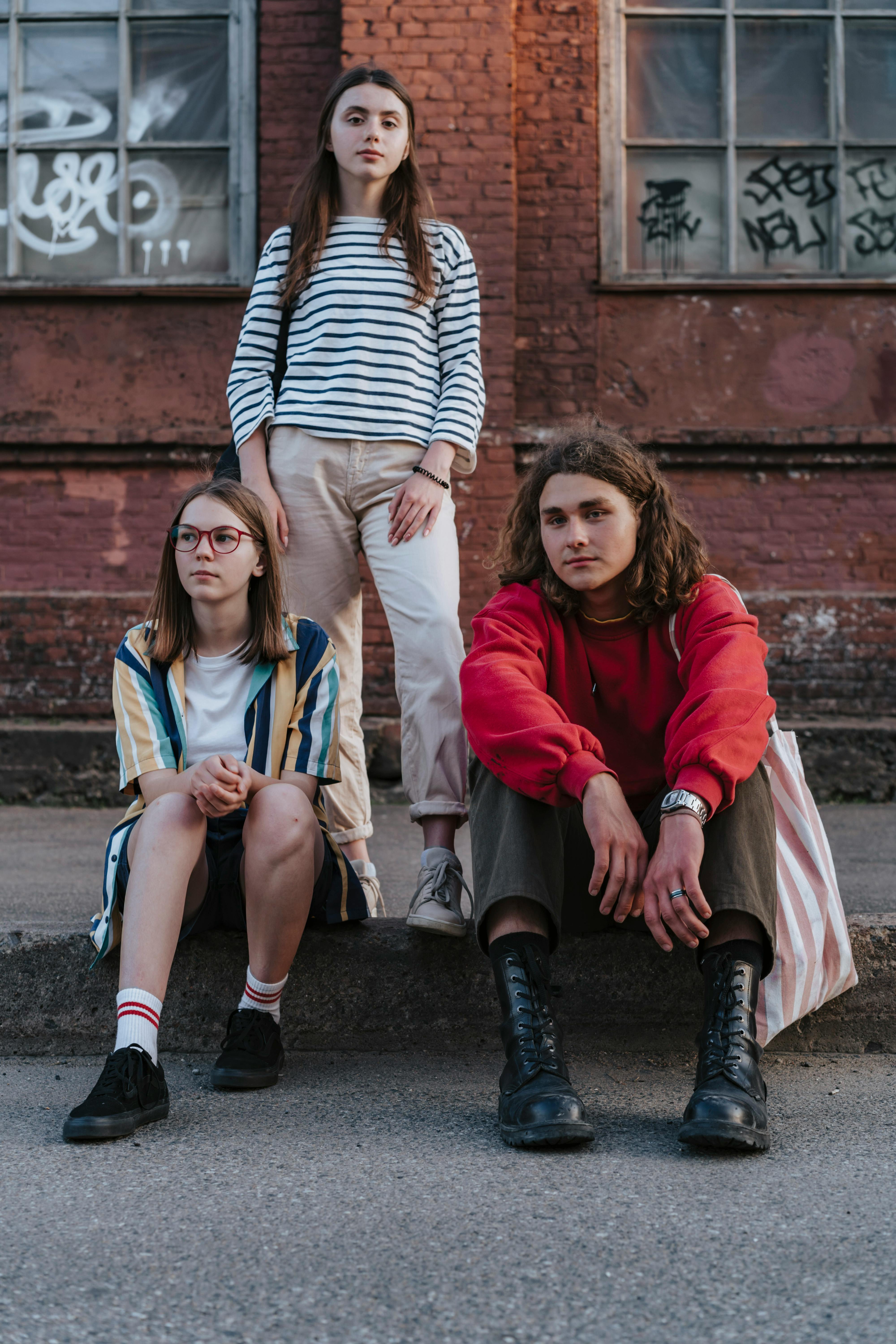 friends hanging out on the curb