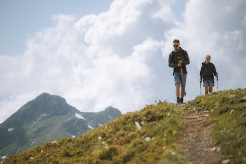 Free A Couple Hiking in the Mountain  Stock Photo