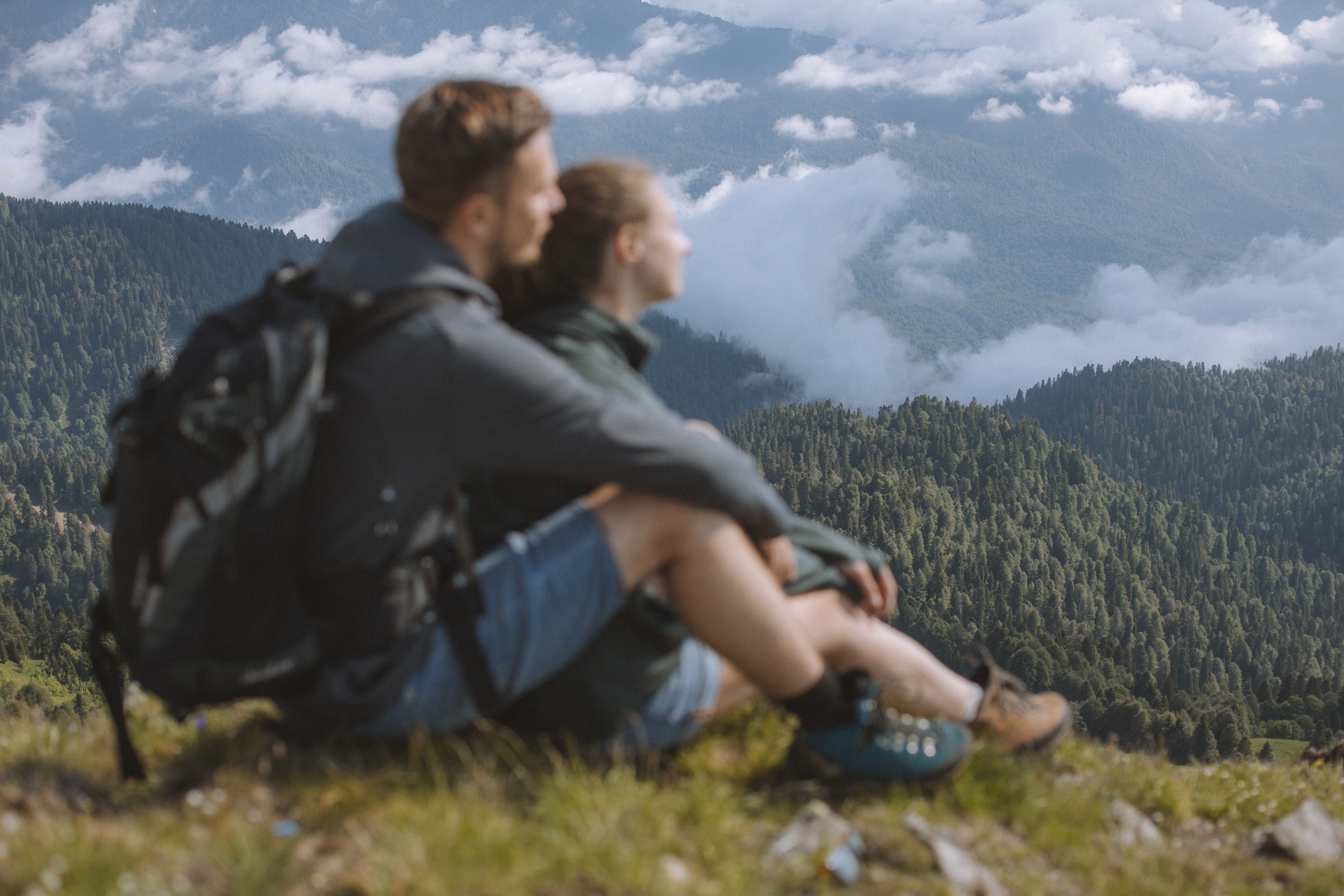 A Romantic Couple Sitting on top of the Mountain · Free Stock Photo
