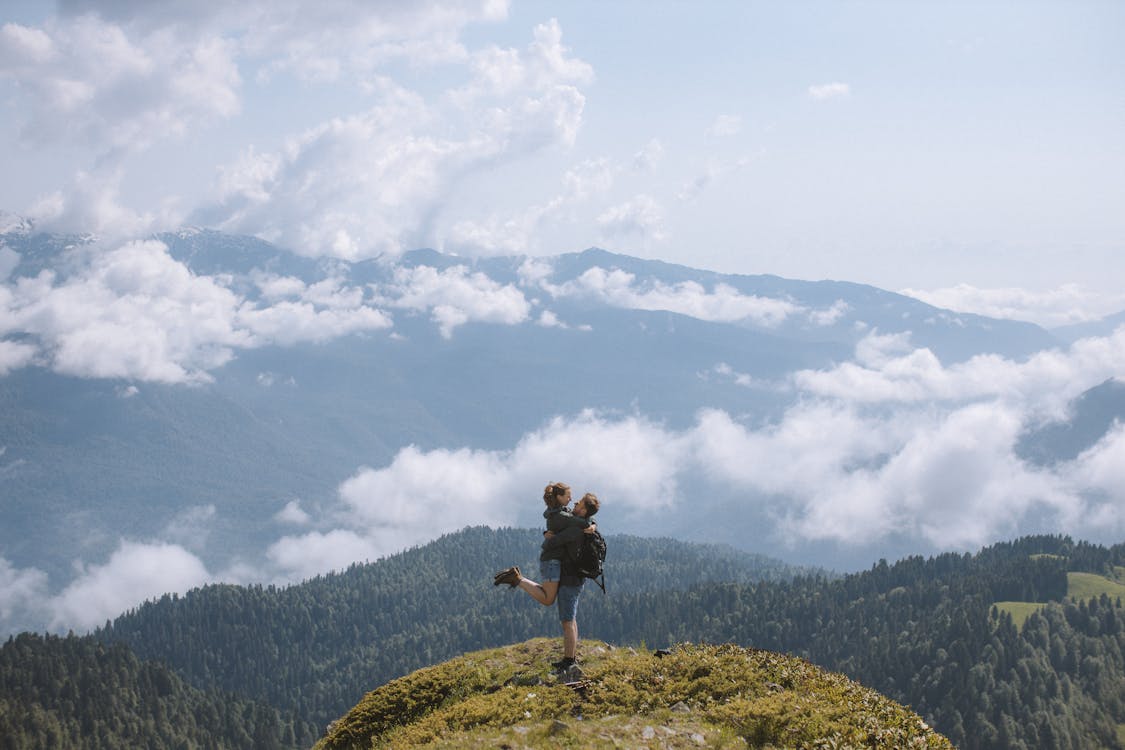 A Couple on Top of a Mountain