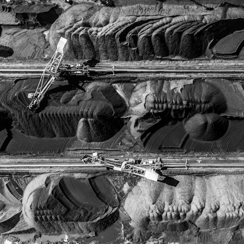 Free Birds Eye View of Heavy Equipment at a Mining Site Stock Photo