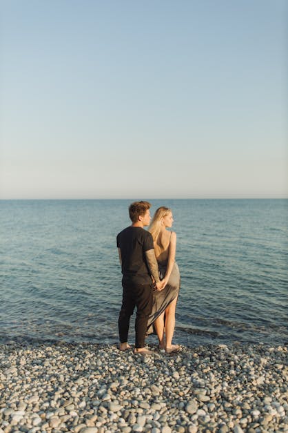 Couple Standing On Beach · Free Stock Photo