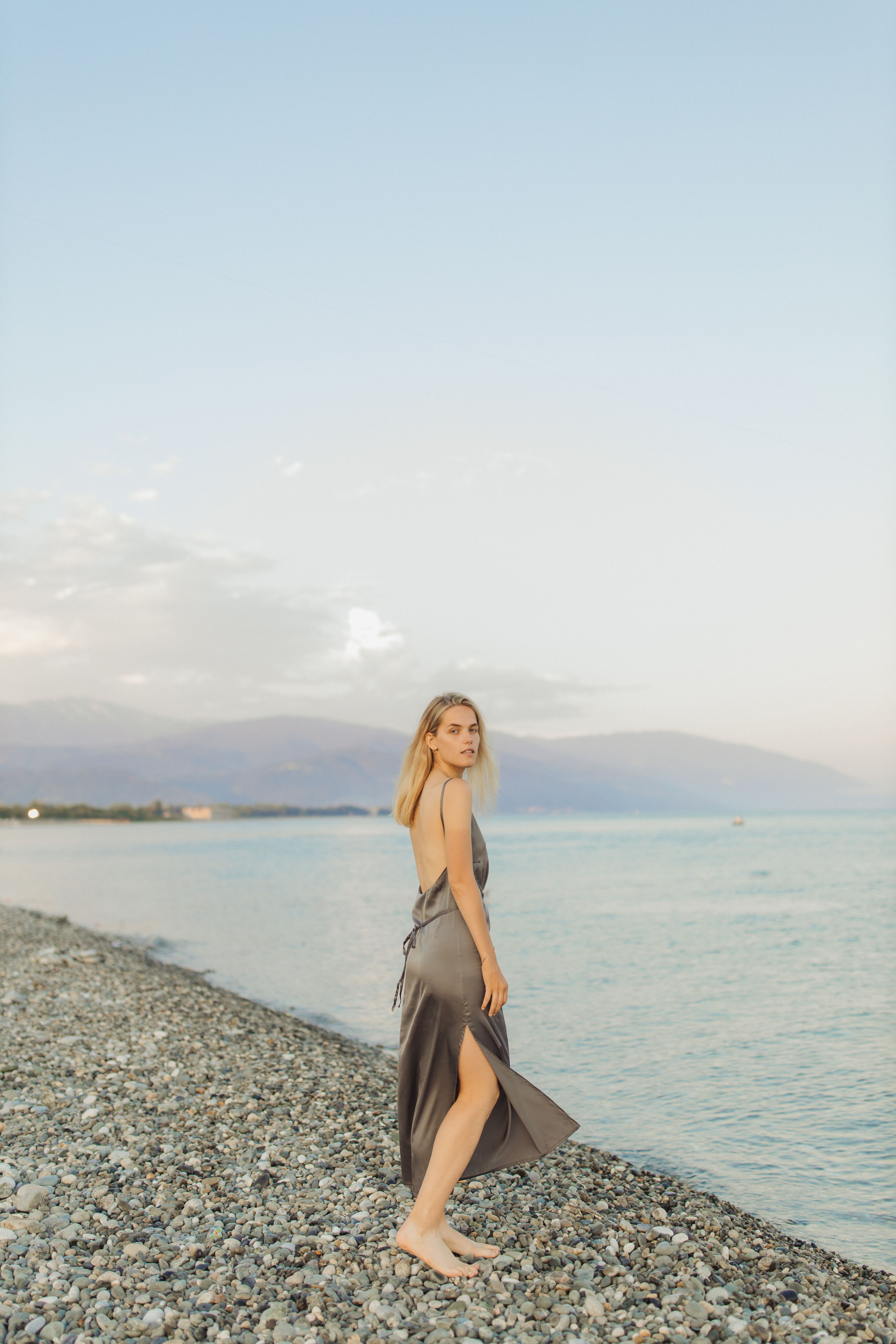 Woman in Spaghetti Strap Dress Standing Near Body of Water · Free Stock ...