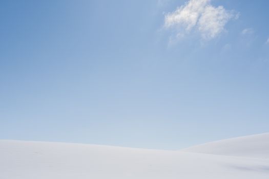 Minimalist snow field and clear blue sky in Troms og Finnmark, Norway.