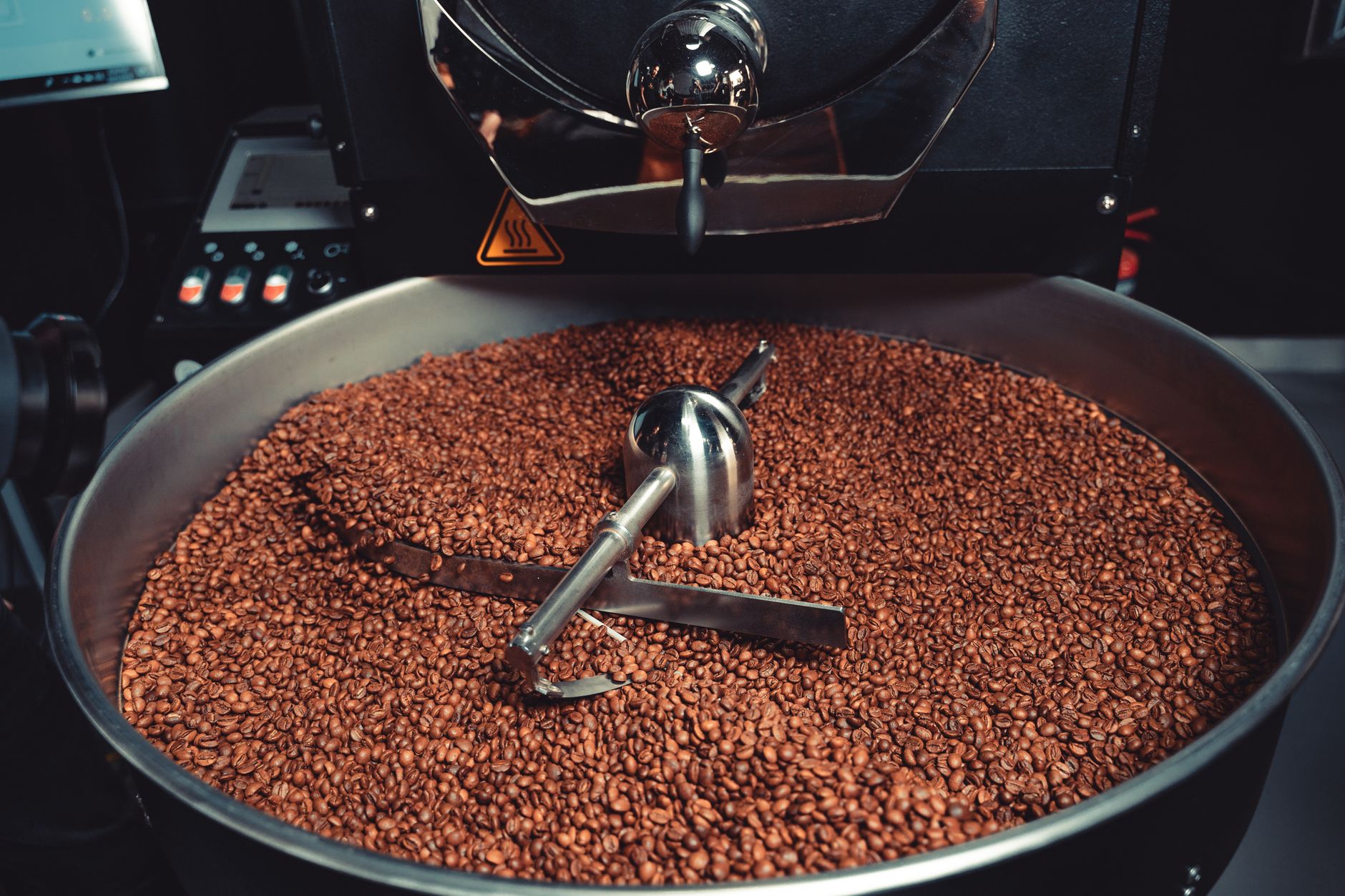 Beans inside industrial roasting drum