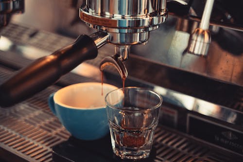 Free Coffee Dripping to a Cup and Glass Stock Photo