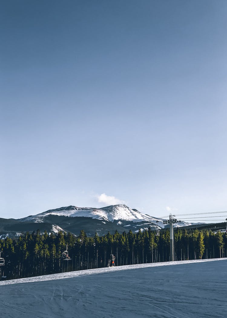 Mountain Slope With Ski Lift And Forest