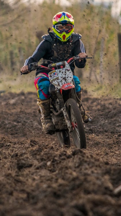 Man in Blue and Black Motorcycle Suit Riding Motocross Dirt Bike