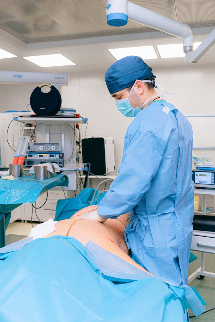 Surgeon Doing Surgery On A Patient 