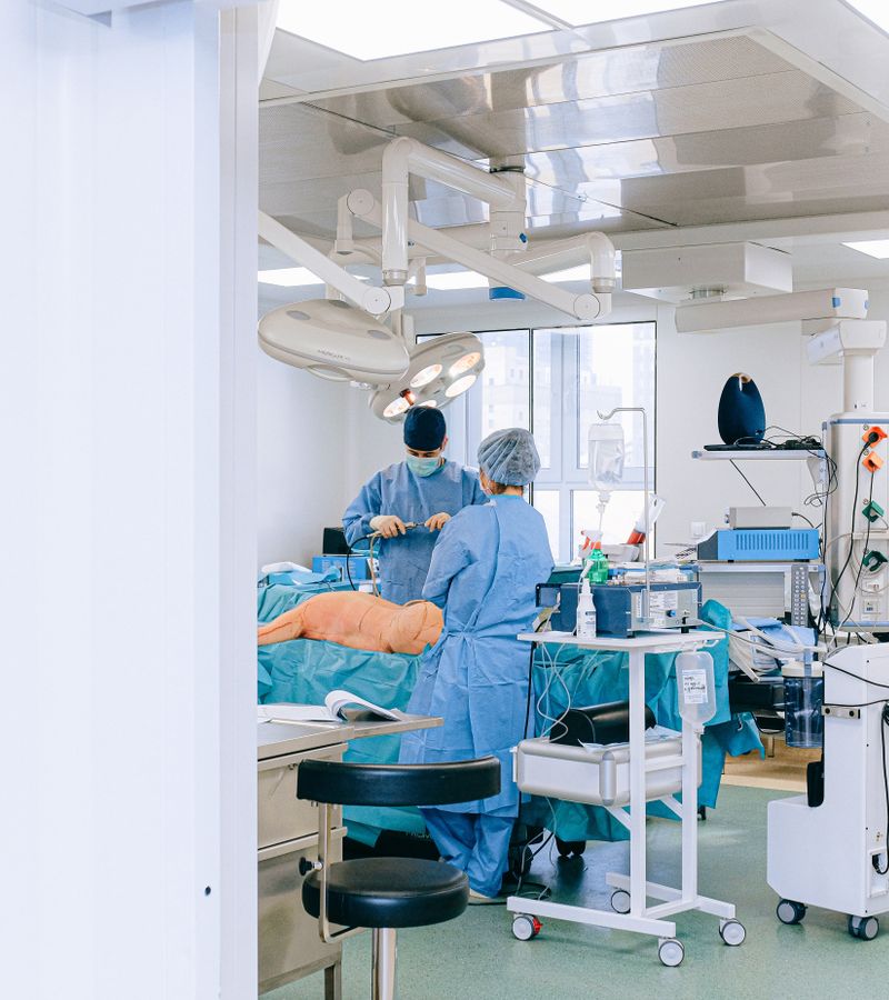 A clinical team working with equipment in an operating room