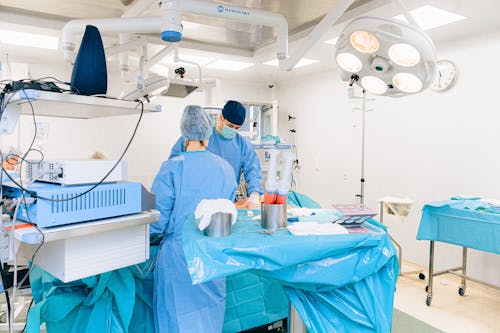 Free Medical Professionals in an Operating Room Stock Photo
