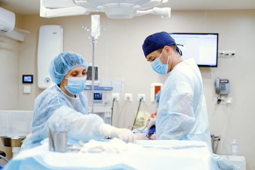 Team of doctors and nurses in an operating room performing surgery with focus and precision.