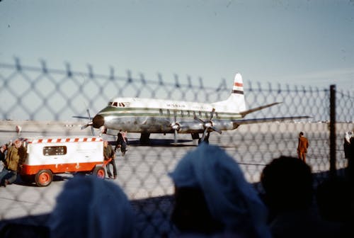 Airplane on Airport Near Chain Link Fence