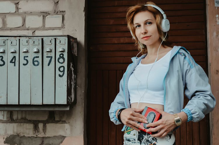 Stylish Woman With Headphones And Personal Stereo