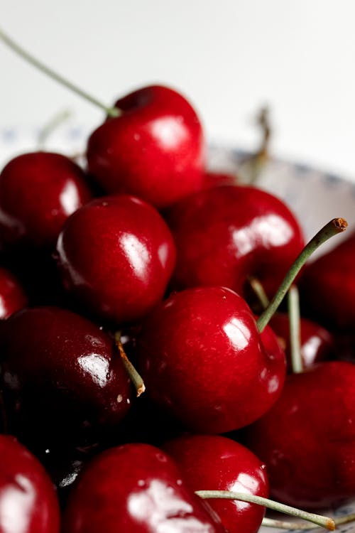 Free Red Cherry Fruit on White Paper Stock Photo