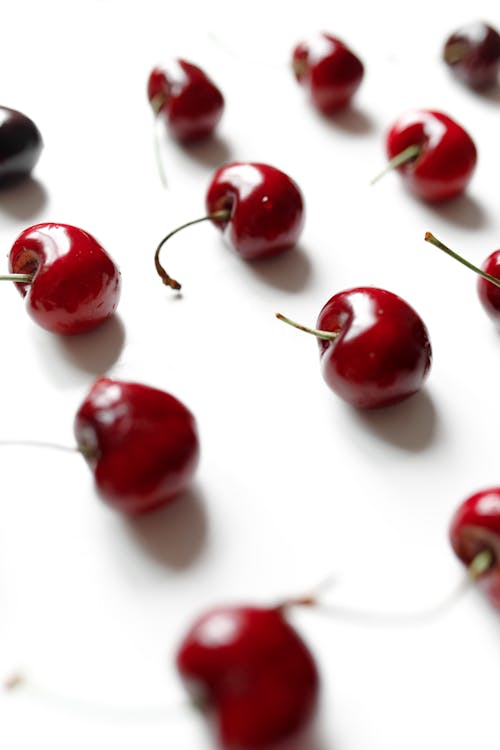 Red Cherries on White Surface